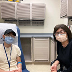 Dr. Alice Chen sits with one of her patients. Credit: National Cancer Institute