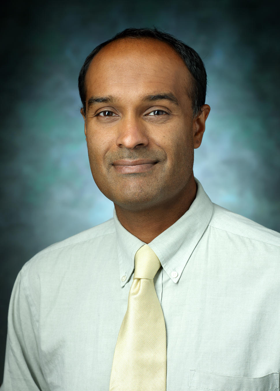 Dr. Verma headshot. 