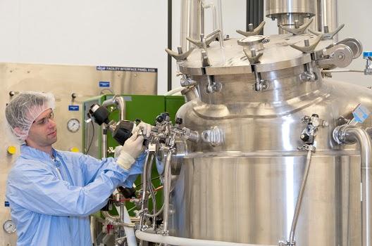 BRB Scientist adjusting machine