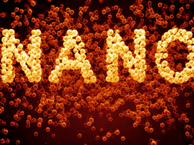 The word “Nano” composed of small, bright colored yellow circles. In the background, similar circles are less bright, more transparent and are colored orange. The background is a red-to-black gradient.