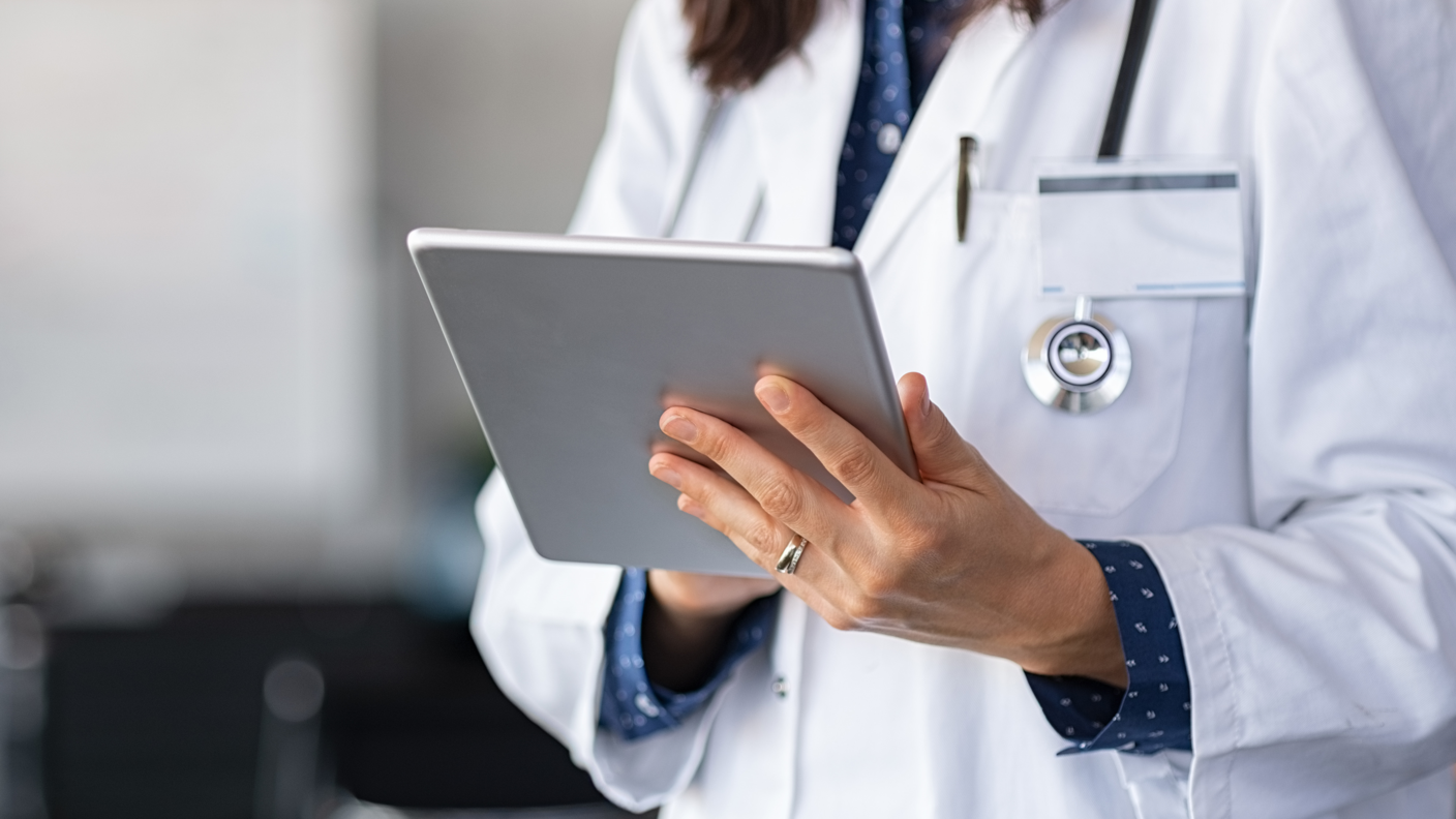 Clinical researcher holding a tablet