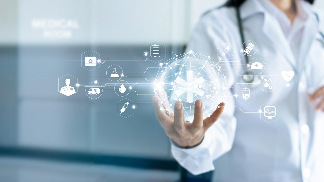 Doctor and medical network connection with modern virtual screen interface in hand on hospital background