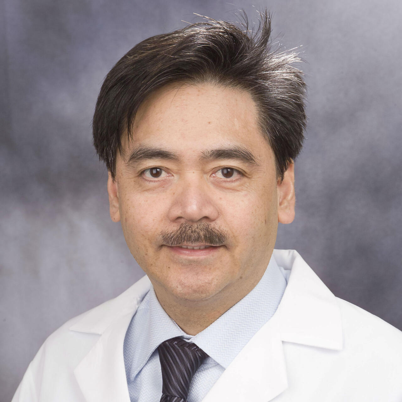 Headshot of Dr. Ceferino Obcemea, Ph.D.