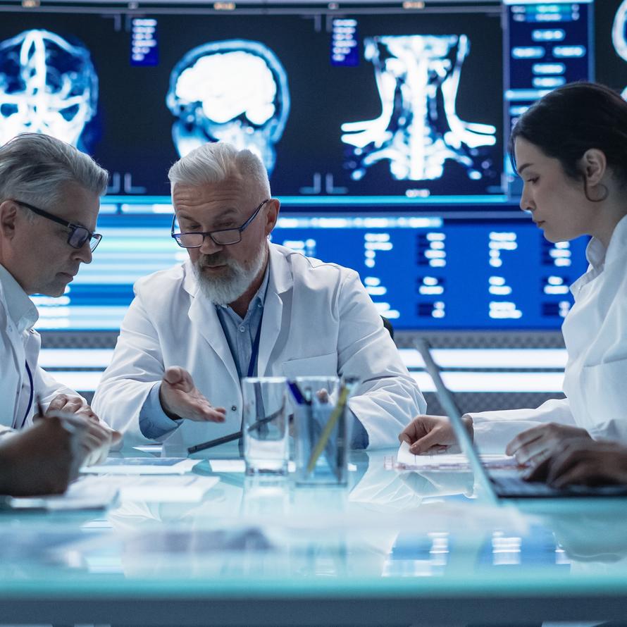 doctors & scientists meeting to discuss radiation therapy