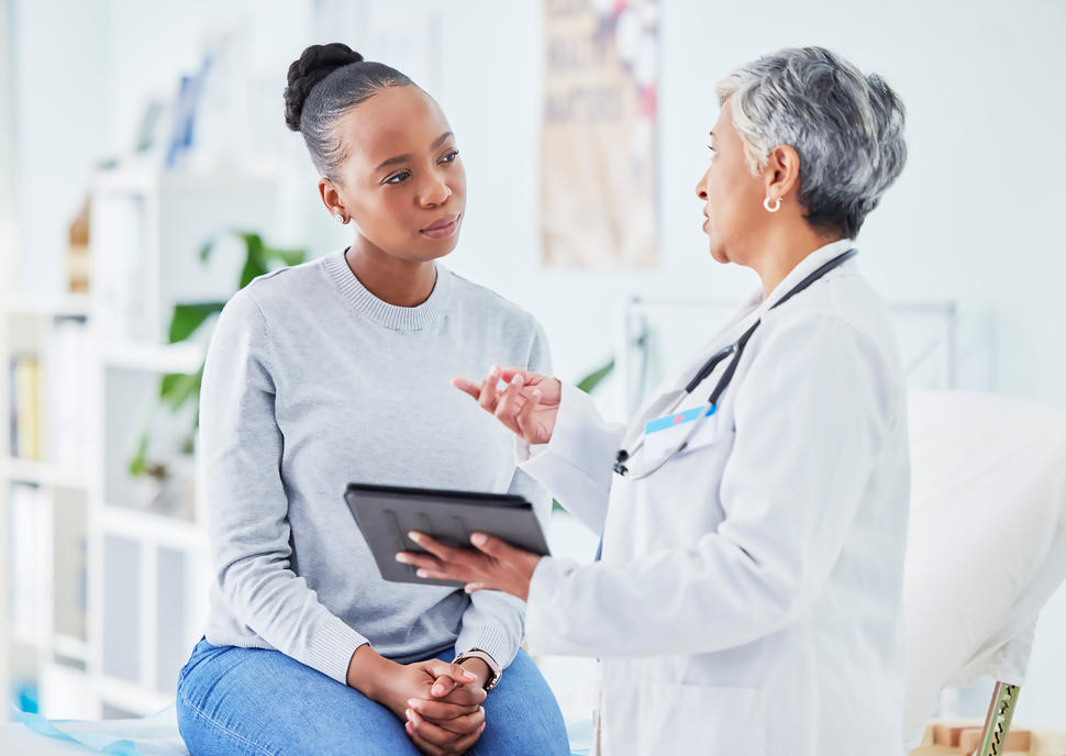 A female patient speaking with a female doctor